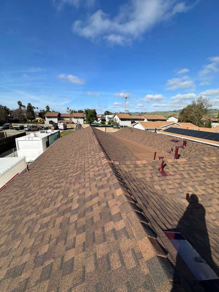 Ridge line of new architectural shingle roof installed by LAAC Roofing in the Bay Area