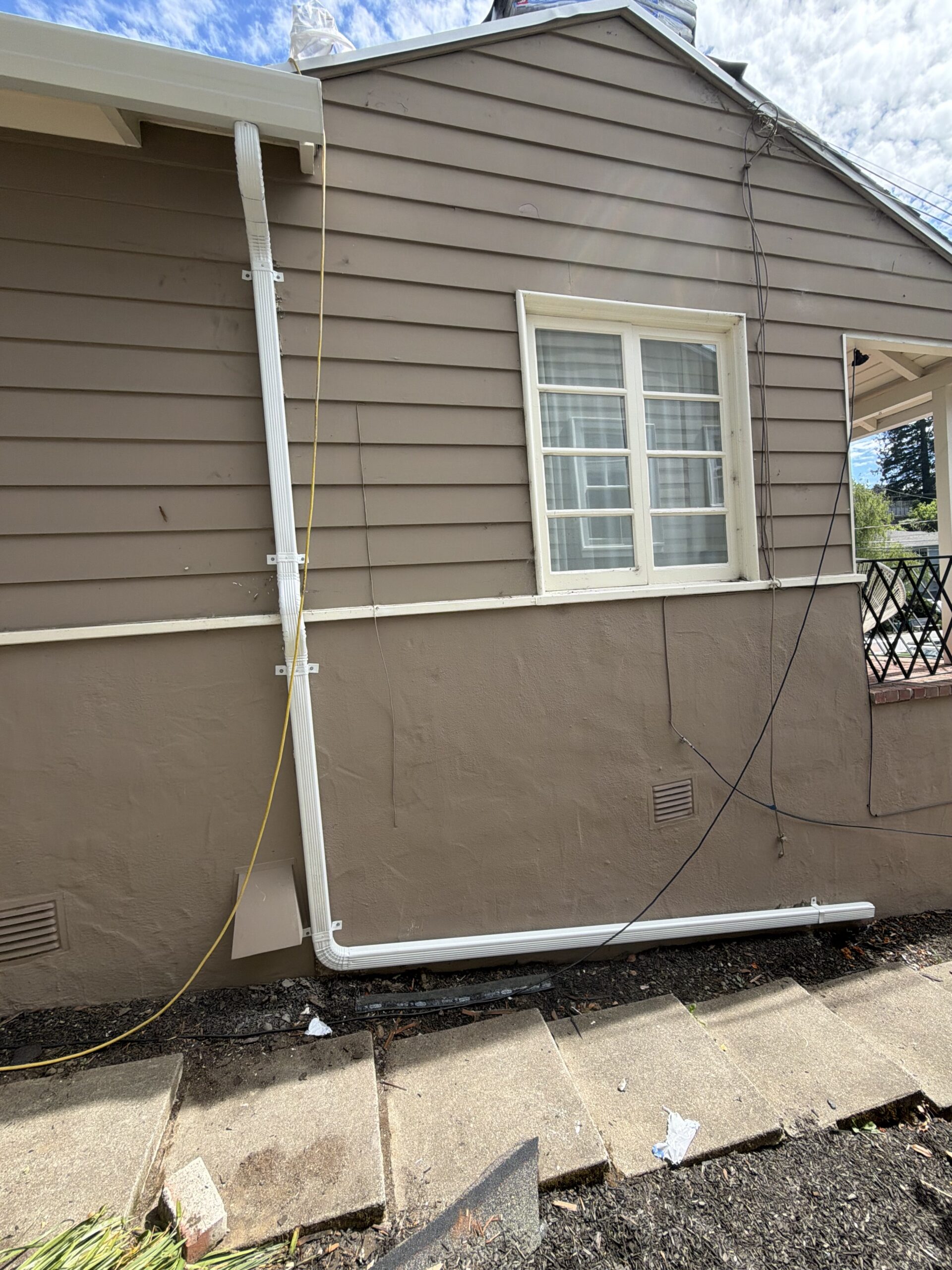 New white aluminum gutter and downspout installation by LAAC Roofing Services Bay Area